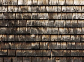 Pattern of cedar shingles on old Cape Cod building-1